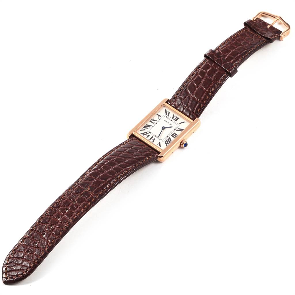 The Cartier Tank Solo W5200025 Men
s Steel and Gold (two tone) Silver Dial W5200025 Men
s Steel and Gold (two tone) Silver Dial watch is shown flat, highlighting its rectangular face, brown leather strap, and clasp.