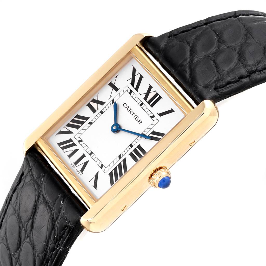 This image shows a close-up angled view of the Cartier Tank Solo W1018855 Men
s Steel and Gold (two tone) Silver Dial W1018855 Men
s Steel and Gold (two tone) Silver Dial watch, highlighting its face, bezel, and black leather strap.