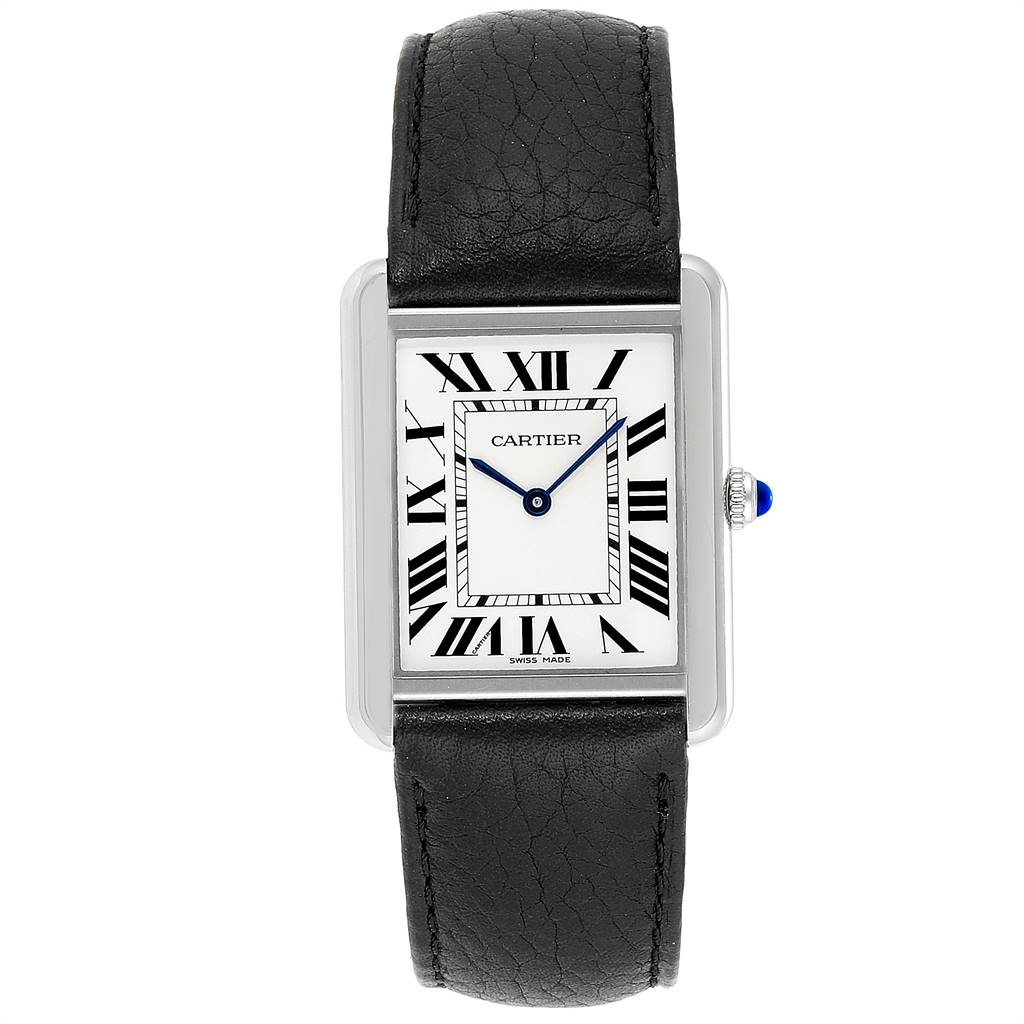 The Tank Solo by Cartier is shown from a top-down angle, displaying the dial, Roman numerals, hands, crown, and leather strap.