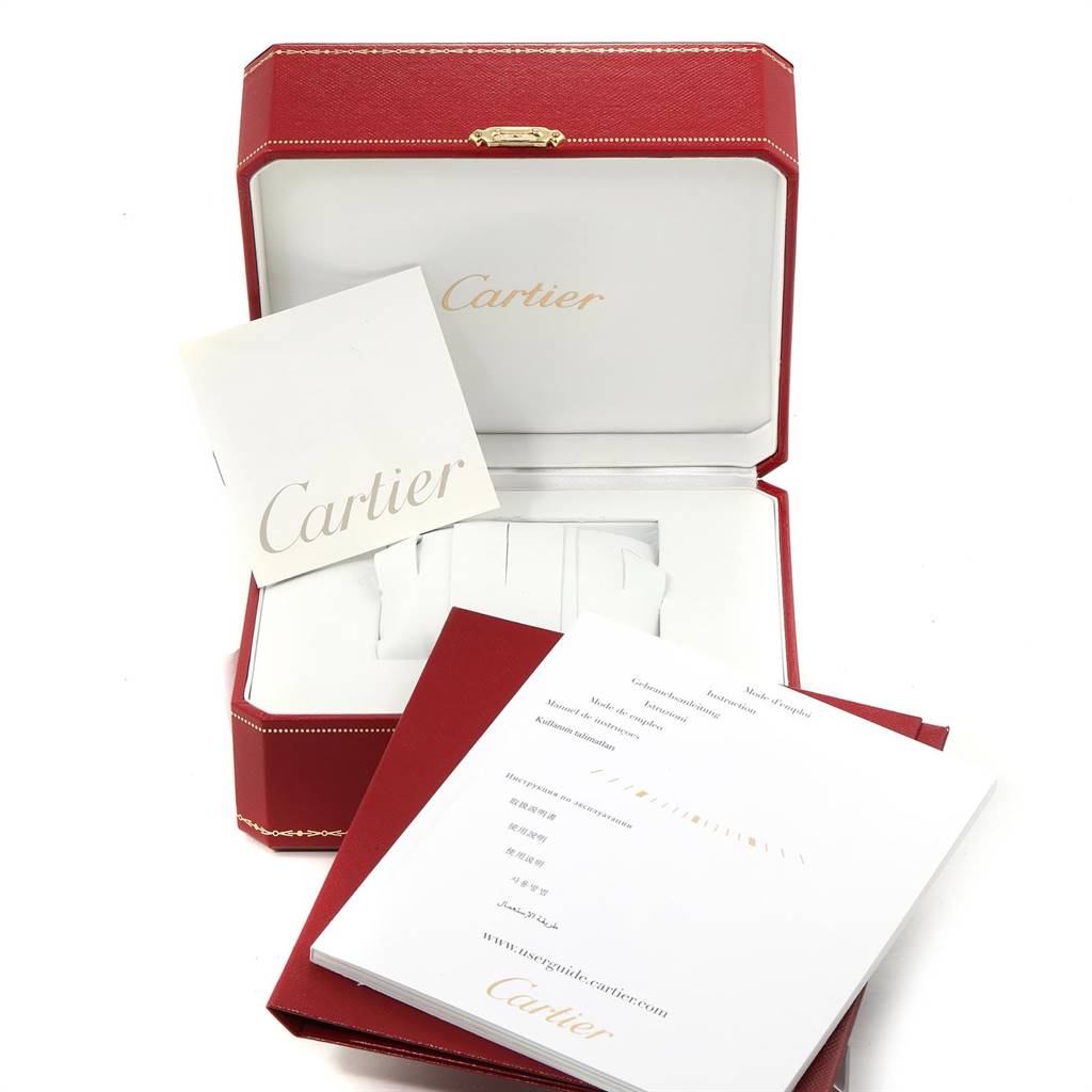 The image shows a Cartier Tank Solo W5200028 Men's Stainless Steel Silver Dial W5200028 Men's Stainless Steel Silver Dial watch box with booklets and packaging materials.