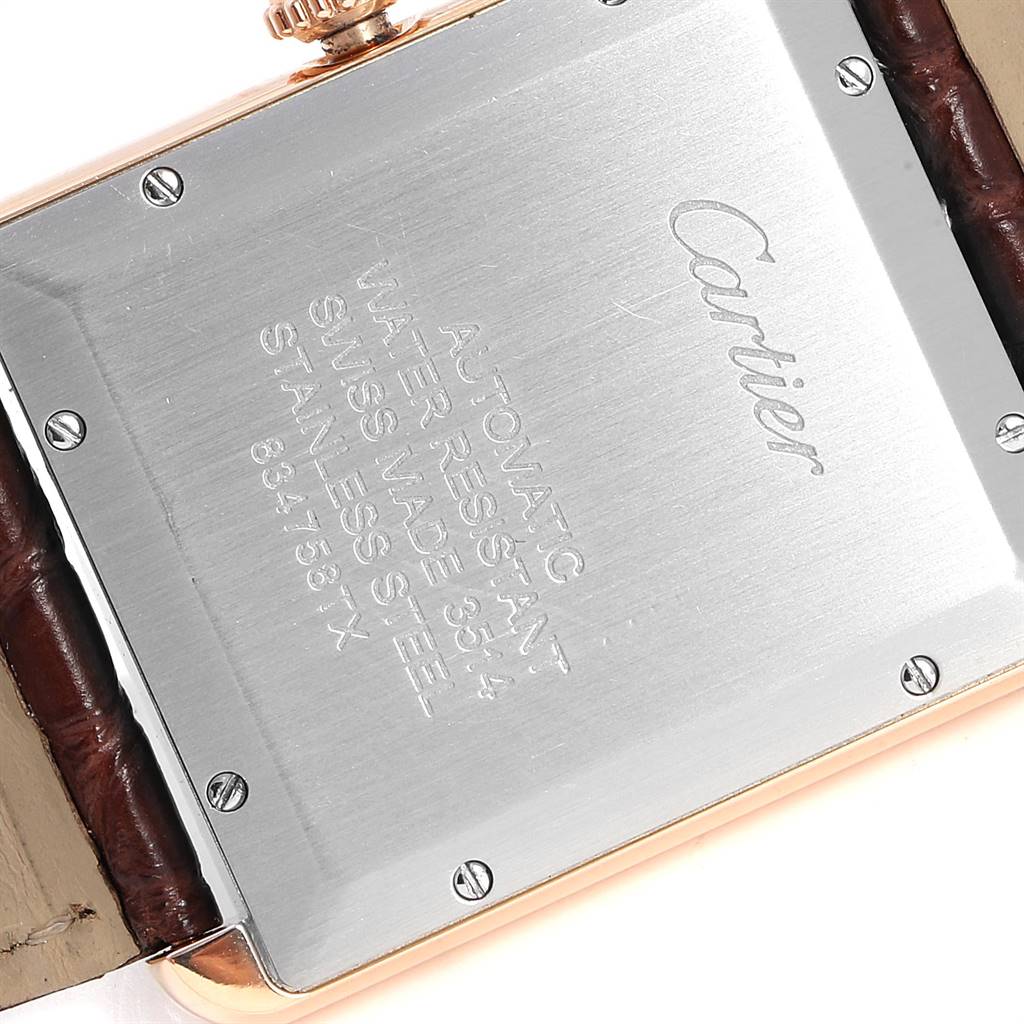 The image shows the back case of a Cartier Tank Solo W5200026 Men's Steel and Gold (two tone) Silver Dial W5200026 Men's Steel and Gold (two tone) Silver Dial watch, highlighting the inscriptions and strap attachment.