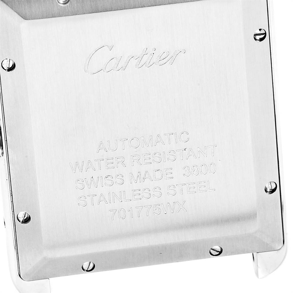 The image shows the back case of a Cartier Tank Solo W5200027 Men's Stainless Steel Silver Dial W5200027 Men's Stainless Steel Silver Dial watch, highlighting its engravings and screws.