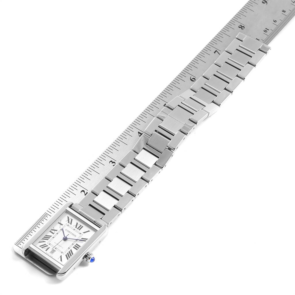 The image shows a top view of a Cartier Tank Solo W5200028 Men's Stainless Steel Silver Dial W5200028 Men's Stainless Steel Silver Dial watch, including the face and metal bracelet, with a ruler for size reference.