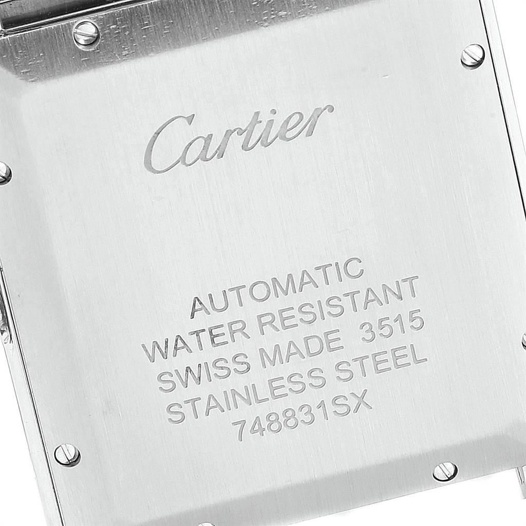 This image shows the back case of a Cartier Tank Solo W5200028 Men's Stainless Steel Silver Dial W5200028 Men's Stainless Steel Silver Dial watch, featuring engravings and screws.