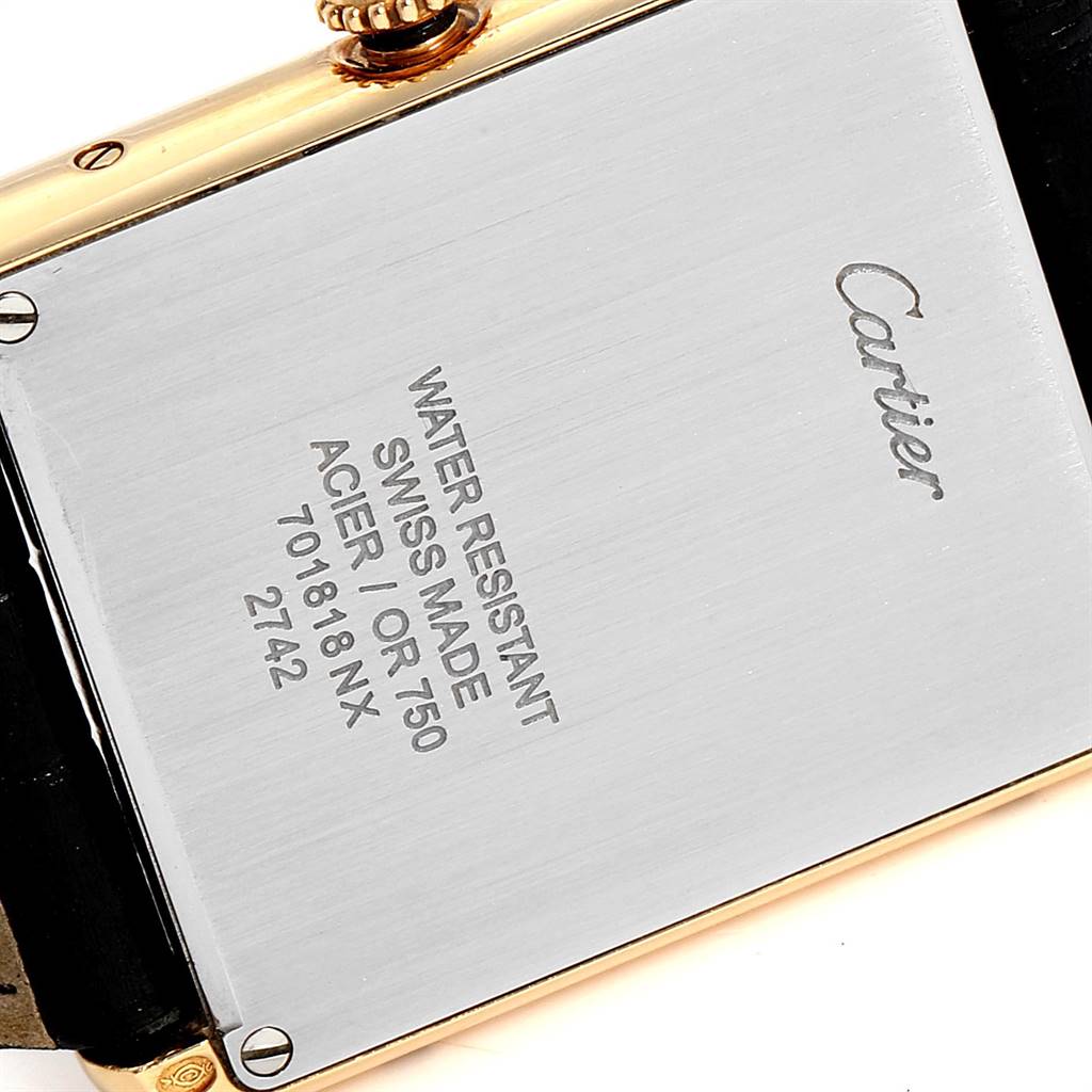 This is an image of the back case of a Cartier Tank Solo W1018855 Men's Steel and Gold (two tone) Silver Dial W1018855 Men's Steel and Gold (two tone) Silver Dial watch, displaying the brand engraving and model details.