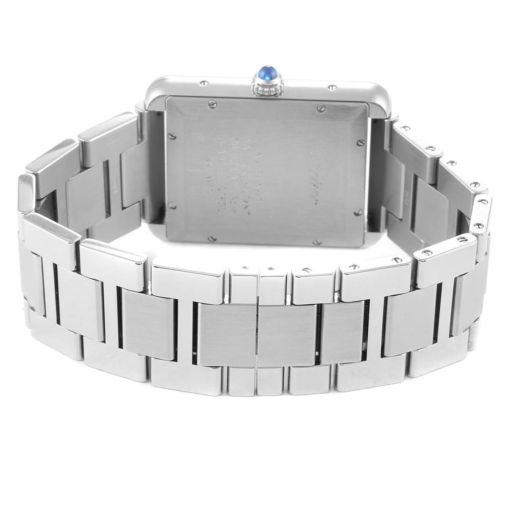 The image shows the back view of the Tank Solo watch by Cartier, highlighting its stainless steel case and bracelet.