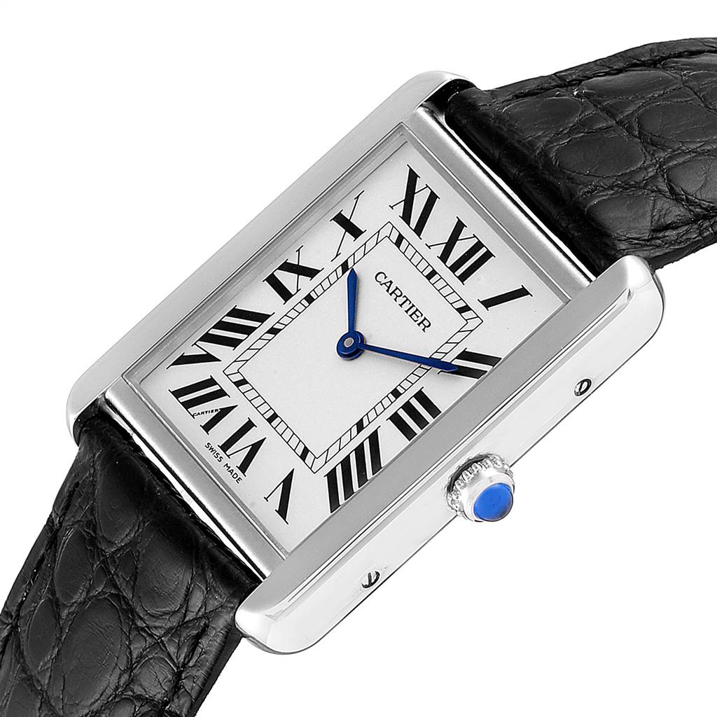 The Cartier Tank Solo W1018355 Men's Stainless Steel Silver Dial W1018355 Men's Stainless Steel Silver Dial watch is shown at an oblique angle, displaying its white Roman numeral dial, blue hands, and black leather strap.