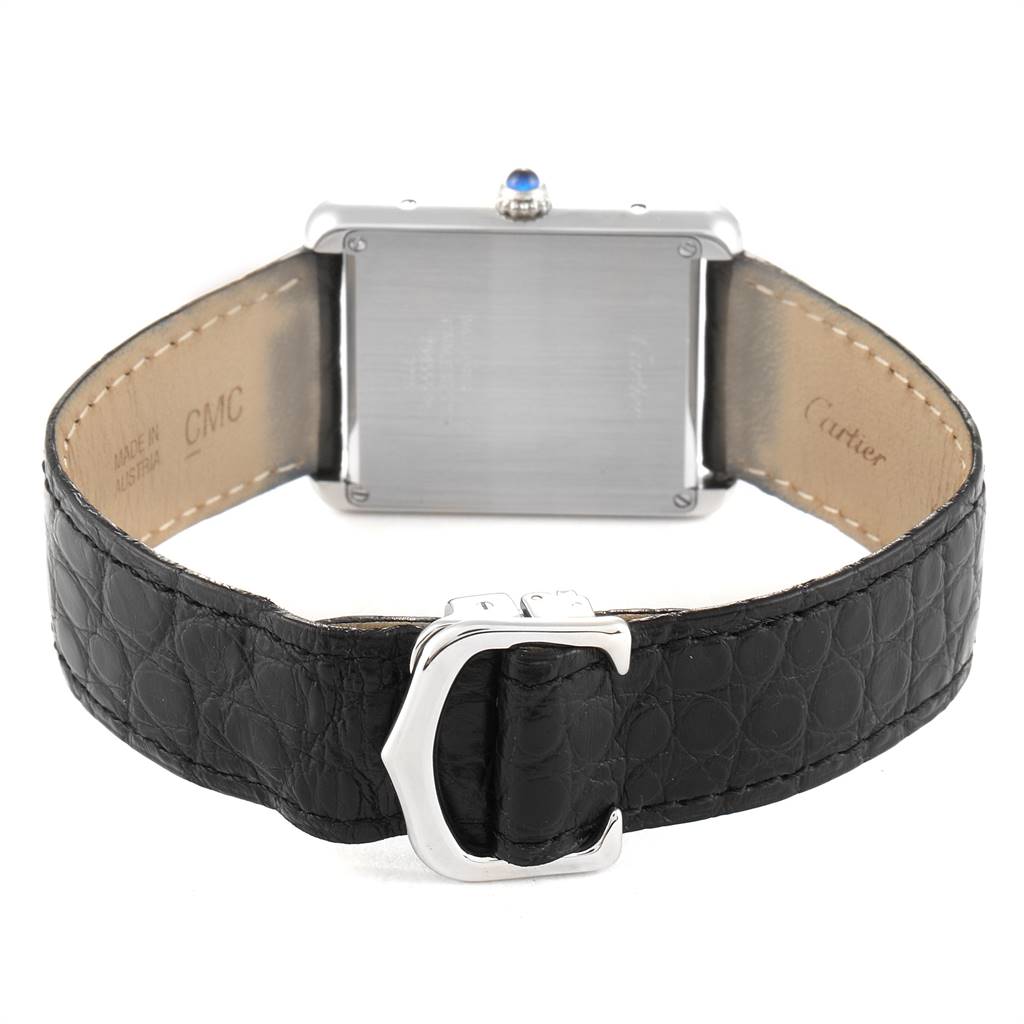 The image shows the back view of a Cartier Tank Solo W1018355 Men's Stainless Steel Silver Dial W1018355 Men's Stainless Steel Silver Dial watch, highlighting its case back, leather strap, and clasp.