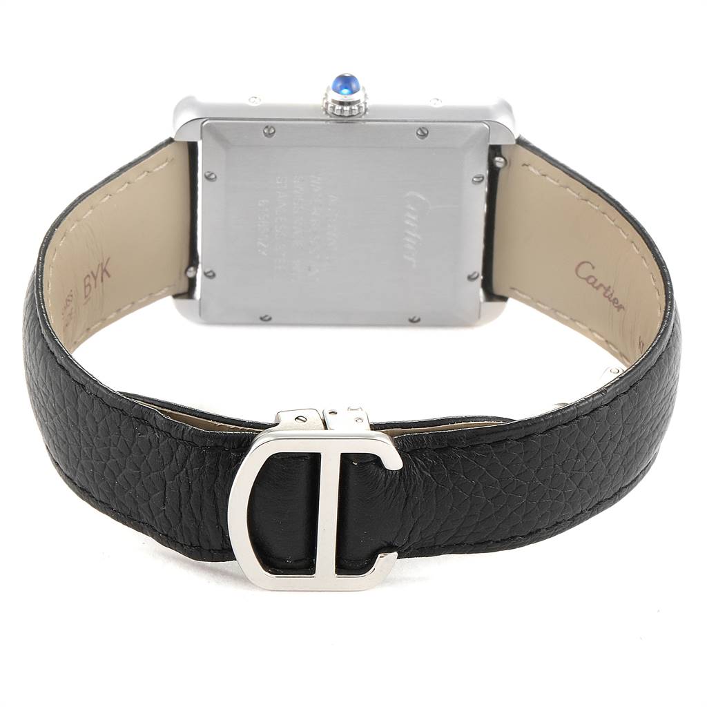This image shows the back of a Cartier Tank Solo W5200027 Men
s Stainless Steel Silver Dial W5200027 Men
s Stainless Steel Silver Dial watch along with its black leather strap and buckle.