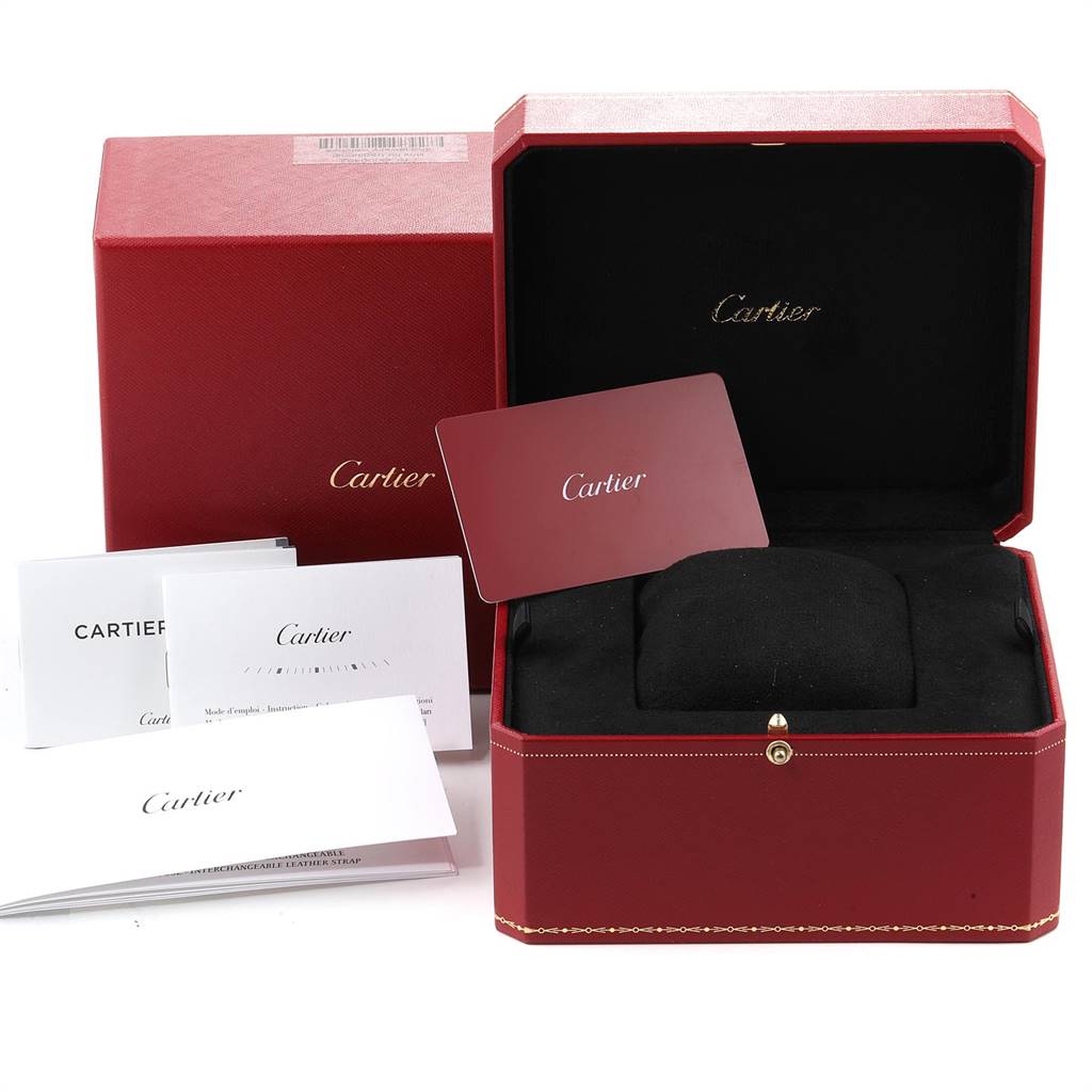 The image shows the packaging and accessories for a Cartier Tank Solo W5200027 Men
s Stainless Steel Silver Dial W5200027 Men
s Stainless Steel Silver Dial watch, including a red box, warranty cards, and booklets.