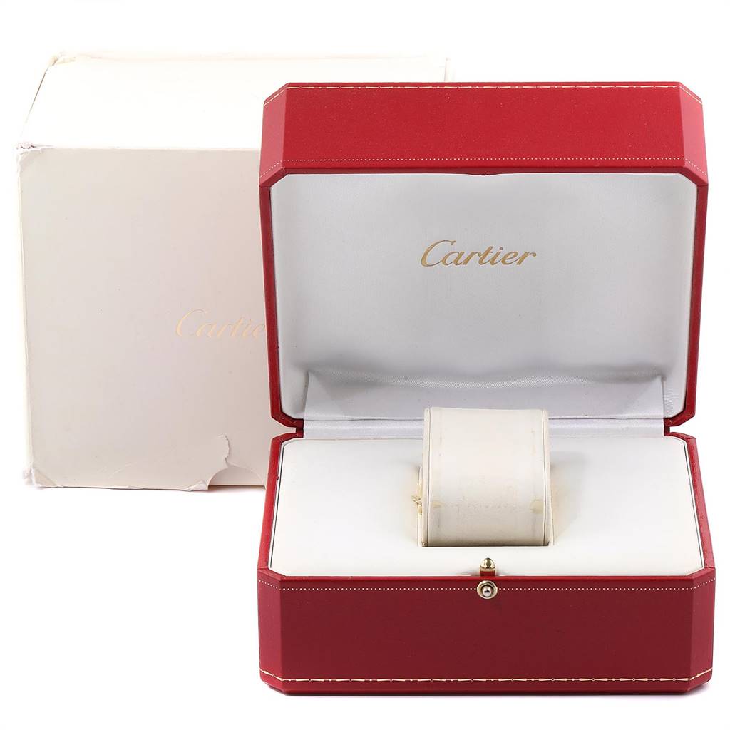 The image shows a Cartier Tank Solo W5200028 Men
s Stainless Steel Silver Dial W5200028 Men
s Stainless Steel Silver Dial watch positioned inside its open red case, displaying only the watch
s strap and part of one side.