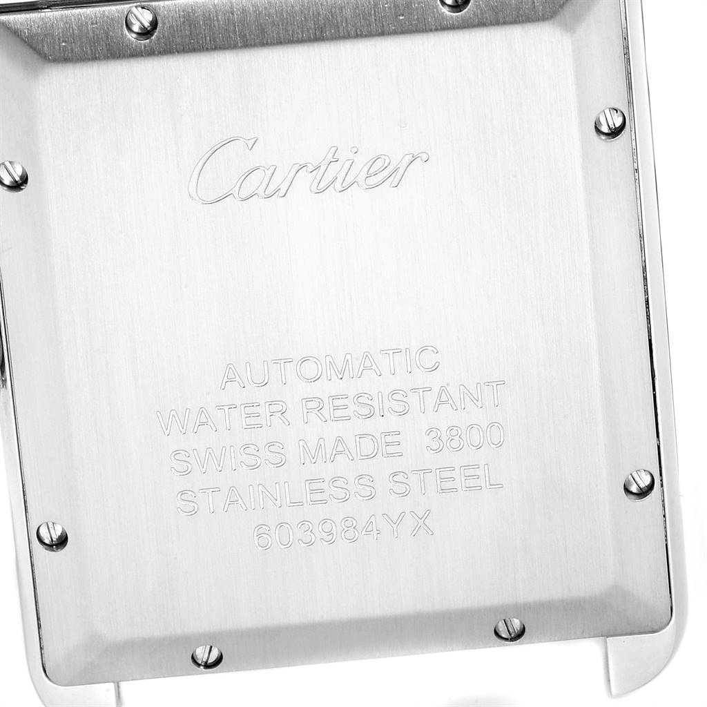 The image shows the stainless steel case back of the Cartier Tank Solo W5200028 Men's Stainless Steel Silver Dial W5200028 Men's Stainless Steel Silver Dial watch, featuring engraved details and screws.