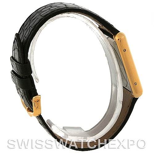 This image shows a side view of the Cartier Tank Solo W1018855 Men
s Steel and Gold (two tone) Silver Dial W1018855 Men
s Steel and Gold (two tone) Silver Dial watch, highlighting its leather strap and gold case.