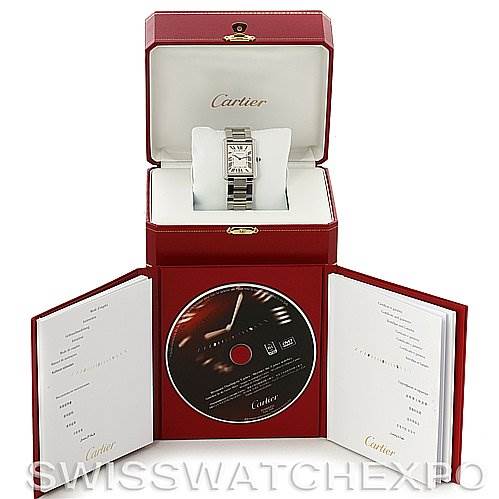 The image shows a Cartier Tank Solo W5200014 Stainless Steel Silver Dial W5200014 Stainless Steel Silver Dial watch in its open case with accompanying documents and a CD.