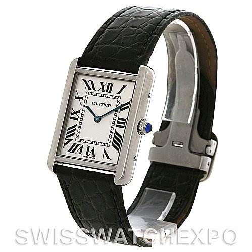This image shows a Cartier Tank Solo W1018355 Men
s Stainless Steel Silver Dial W1018355 Men
s Stainless Steel Silver Dial watch at an angled side view, highlighting the rectangular face, leather strap, and deployment clasp.