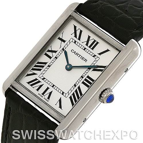 The image shows a Cartier Tank Solo W1018355 Men
s Stainless Steel Silver Dial W1018355 Men
s Stainless Steel Silver Dial watch at an angle displaying its face, Roman numeral dial, and a portion of its black leather strap.