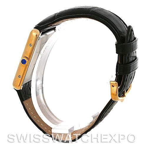 The image shows a side profile of the Cartier Tank Solo W1018855 Men
s Steel and Gold (two tone) Silver Dial W1018855 Men
s Steel and Gold (two tone) Silver Dial watch, highlighting its gold casing, blue crown, and black leather strap.