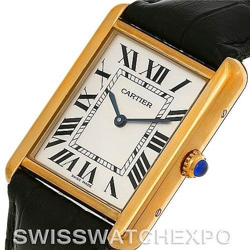 This image features a Cartier Tank Solo W1018855 Men
s Steel and Gold (two tone) Silver Dial W1018855 Men
s Steel and Gold (two tone) Silver Dial watch at an angled view, showcasing the dial, rectangular case, crown, and leather strap.
