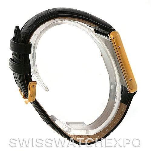 This image shows a side view of a Cartier Tank Solo W1018855 Men
s Steel and Gold (two tone) Silver Dial W1018855 Men
s Steel and Gold (two tone) Silver Dial watch, displaying its strap, buckle, and case.