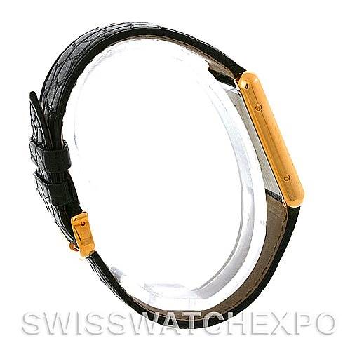 The image shows a side profile of the Cartier Tank Solo W1018855 Men
s Steel and Gold (two tone) Silver Dial W1018855 Men
s Steel and Gold (two tone) Silver Dial watch, highlighting its strap and case.