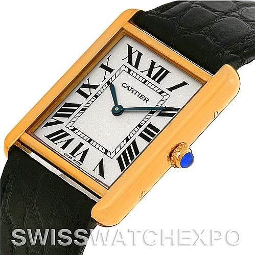 The image shows a Cartier Tank Solo W1018855 Men
s Steel and Gold (two tone) Silver Dial W1018855 Men
s Steel and Gold (two tone) Silver Dial watch at an angled view, highlighting its rectangular case, Roman numerals, and blue cabochon crown.