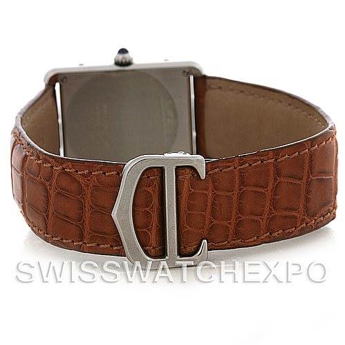 The image shows the backside of a Tank Solo Cartier watch, highlighting its brown leather strap and clasp.