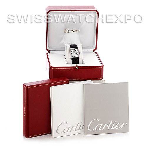 The Cartier Tank Solo W1018355 Men's Stainless Steel Silver Dial W1018355 Men's Stainless Steel Silver Dial watch is displayed in an open red box, with additional packaging and booklets beside it.