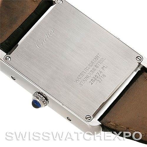 The image shows the back case and crown of a Cartier Tank Solo W1018355 Men's Stainless Steel Silver Dial W1018355 Men's Stainless Steel Silver Dial watch, highlighting its stainless steel and water-resistant features.