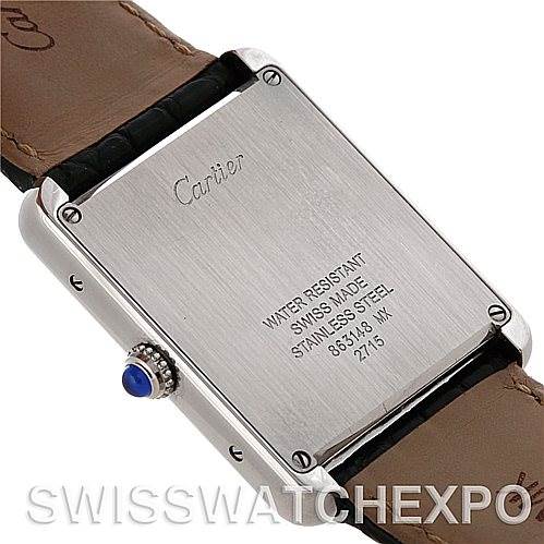 The image shows the back case and strap of a Cartier Tank Solo W1018355 Men's Stainless Steel Silver Dial W1018355 Men's Stainless Steel Silver Dial watch, featuring its engravings and a blue cabochon on the crown.