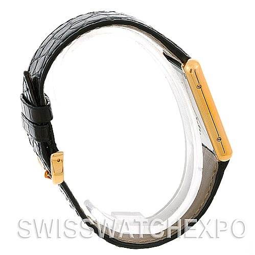 The image shows a side view of a Rolex Submariner W1018855 Men's Stainless Steel Silver Dial W1018855 Men's Stainless Steel Silver Dial watch, highlighting the black leather strap and golden case side.