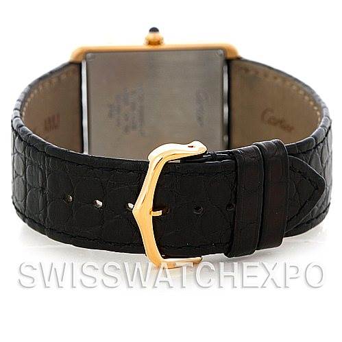 This image is not of a Rolex Submariner W1018855 Men's Stainless Steel Silver Dial W1018855 Men's Stainless Steel Silver Dial but of a different timepiece, showing the back of a rectangular case and a leather strap with a gold buckle.