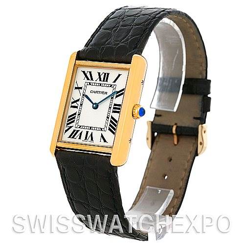 This image shows a Cartier watch with a rectangular face, Roman numeral markers, and a black leather strap, viewed from a slight side angle.