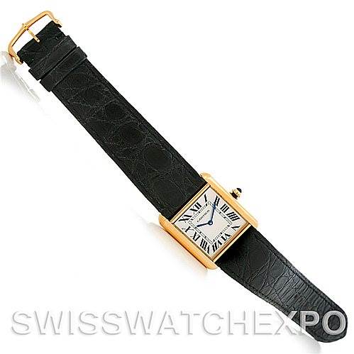 The image shows a Cartier Tank Solo W1018855 Men
s Steel and Gold (two tone) Silver Dial W1018855 Men
s Steel and Gold (two tone) Silver Dial watch with a rectangular gold case and black leather strap from a top-down angle.