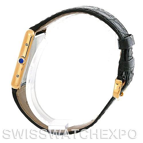 This image shows the side profile of a Cartier Tank Solo W1018855 Men
s Steel and Gold (two tone) Silver Dial W1018855 Men
s Steel and Gold (two tone) Silver Dial watch, highlighting the gold case and blue cabochon crown.