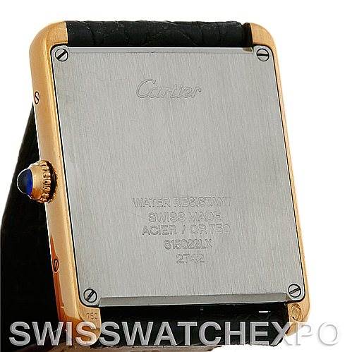 The image shows the back case and side view of a Cartier Tank Solo W1018855 Men
s Steel and Gold (two tone) Silver Dial W1018855 Men
s Steel and Gold (two tone) Silver Dial watch, highlighting the crown with a blue cabochon.