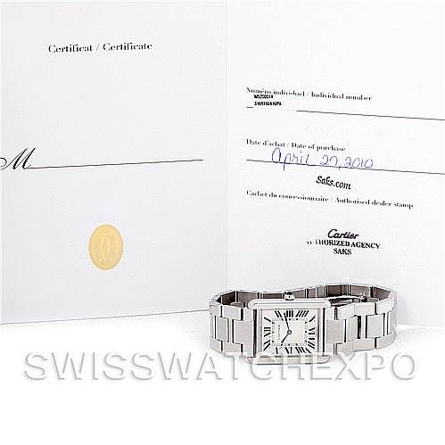 The image shows a Cartier Tank Solo W5200014 Men
s Stainless Steel Silver Dial W5200014 Men
s Stainless Steel Silver Dial watch and its certificate of Best Quality
ity, displayed from an overhead angle.