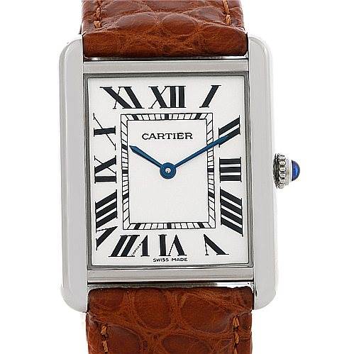 The image shows a frontal view of a Cartier Tank Solo W1018355 Men
s Stainless Steel Silver Dial W1018355 Men
s Stainless Steel Silver Dial watch, highlighting its face, hands, and crown with a brown leather strap.