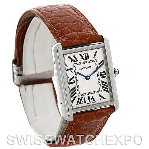 The Cartier Tank Solo W1018355 Men
s Stainless Steel Silver Dial W1018355 Men
s Stainless Steel Silver Dial watch is shown at a three-quarter angle, highlighting its brown leather strap, rectangular face, and Roman numeral dial.