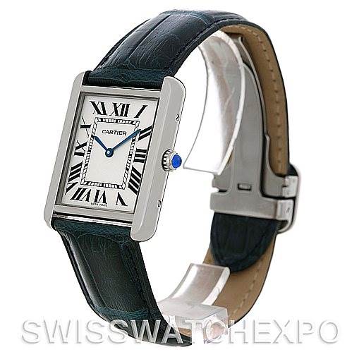 The image shows a side angle view of the Cartier Tank Solo W1018355 Men
s Stainless Steel Silver Dial W1018355 Men
s Stainless Steel Silver Dial watch, highlighting its face, strap, and clasp.