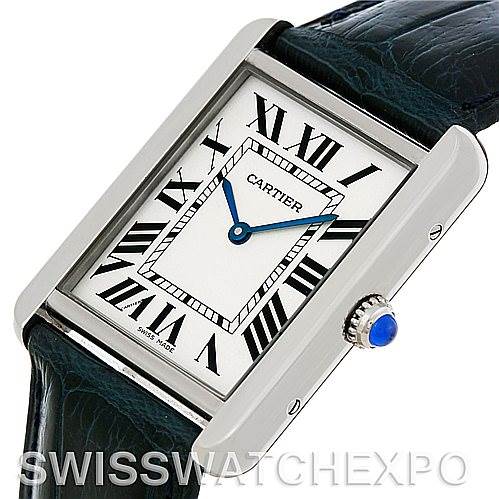The image shows a Cartier Tank Solo W1018355 Men
s Stainless Steel Silver Dial W1018355 Men
s Stainless Steel Silver Dial watch face and partial leather strap from a front angle.