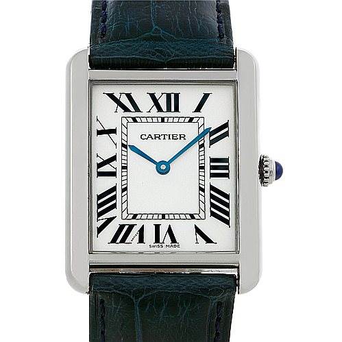The image shows a close-up of the Cartier Tank Solo W1018355 Men
s Stainless Steel Silver Dial W1018355 Men
s Stainless Steel Silver Dial watch face, including the Roman numeral dial, blue hands, and part of the strap.