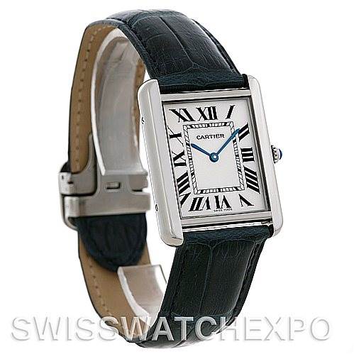 The image shows a side angle of the Cartier Tank Solo W1018355 Men
s Stainless Steel Silver Dial W1018355 Men
s Stainless Steel Silver Dial watch, highlighting its strap, case, dial, and Roman numeral markers.