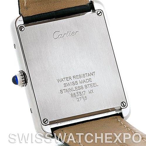 The image shows the back of a Cartier Tank Solo W1018355 Men
s Stainless Steel Silver Dial W1018355 Men
s Stainless Steel Silver Dial watch, featuring its case back engravings and leather strap attachment.