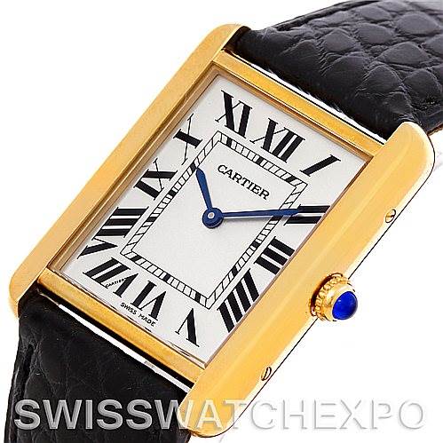 This image shows the Cartier Tank Solo W1018855 Men
s Steel and Gold (two tone) Silver Dial W1018855 Men
s Steel and Gold (two tone) Silver Dial watch at an angled view, highlighting its face, gold frame, crown, and black leather strap.