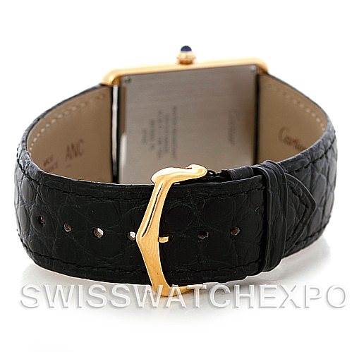 The image shows a rear perspective of the Cartier Tank Solo W1018855 Men
s Steel and Gold (two tone) Silver Dial W1018855 Men
s Steel and Gold (two tone) Silver Dial watch, highlighting its black leather strap and gold buckle.