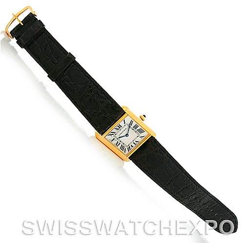 The Cartier Tank Solo W1018855 Men's Steel and Gold (two tone) Silver Dial W1018855 Men's Steel and Gold (two tone) Silver Dial watch is shown from a top-down angle, displaying the face, case, crown, and leather strap.