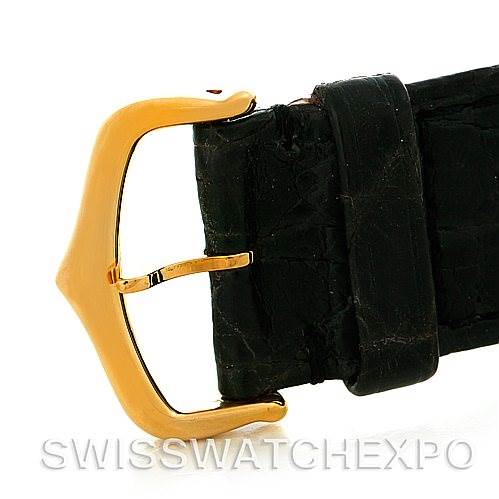 The image shows a close-up of the gold buckle and black leather strap of a Cartier Tank Solo W1018855 Men's Steel and Gold (two tone) Silver Dial W1018855 Men's Steel and Gold (two tone) Silver Dial watch.