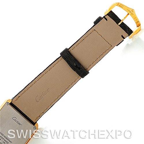 This image shows the back of a Cartier Tank Solo W1018855 Men's Steel and Gold (two tone) Silver Dial W1018855 Men's Steel and Gold (two tone) Silver Dial watch, focusing on its leather strap and gold-tone buckle.