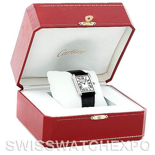 The Cartier Tank Solo W1018355 Men
s Stainless Steel Silver Dial W1018355 Men
s Stainless Steel Silver Dial watch is displayed at an angle inside its red box, showcasing the face and part of the strap.