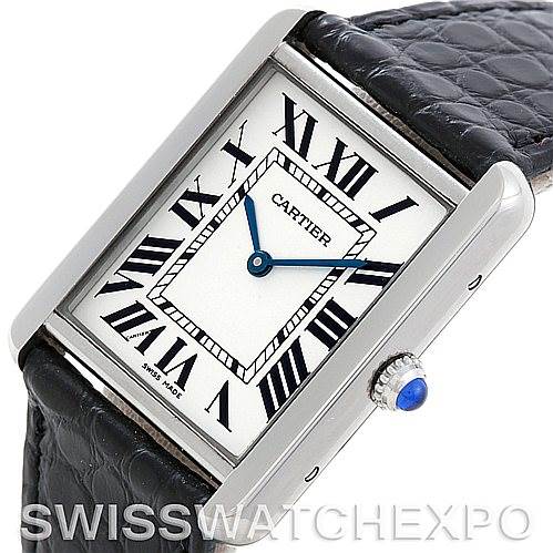 The image shows a close-up angle of the Cartier Tank Solo W1018355 Men
s Stainless Steel Silver Dial W1018355 Men
s Stainless Steel Silver Dial watch, highlighting the face, Roman numerals, hands, and part of the black leather strap.